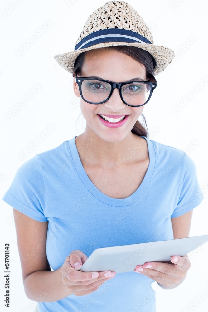 Smiling woman using her tablet looking at camera Smiling woman using her tablet looking at camera