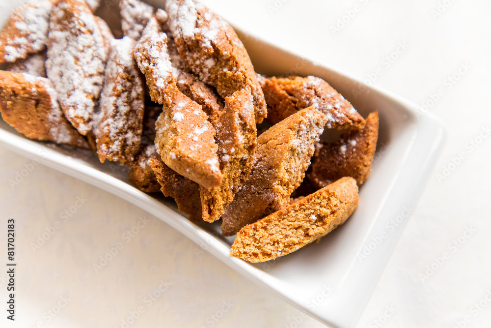 Cantucci biscuits flavored cinnamon with powdered sugar Cantucci biscuits flavored cinnamon with powdered sugar