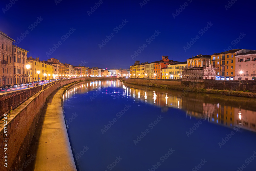 City center of Pisa with reflection in Arno river, Italy