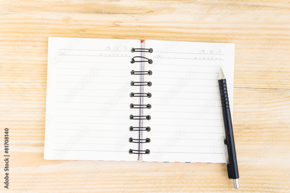 Notebook on wood table for background Notebook on wood table for background