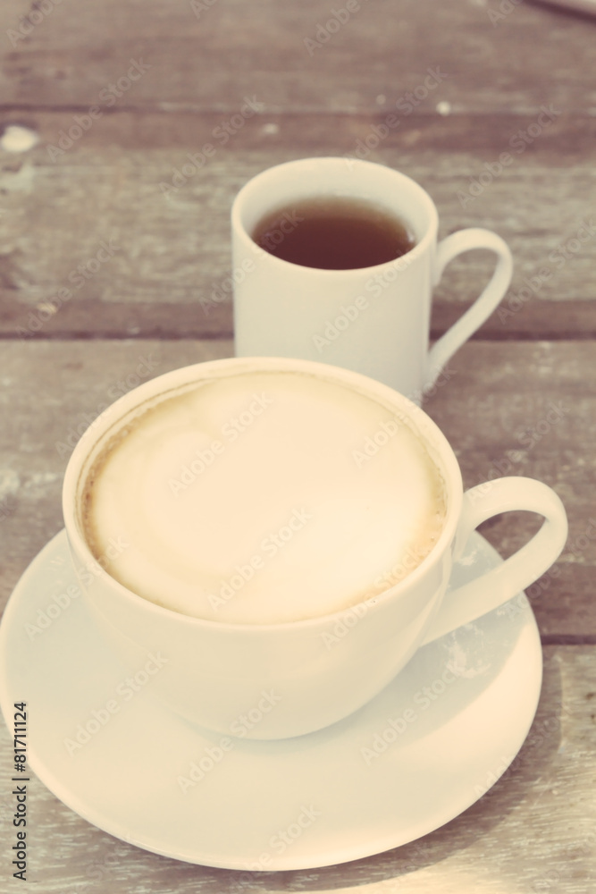 Cup of hot coffee and tea on wood table background Cup of hot coffee and tea on wood table background