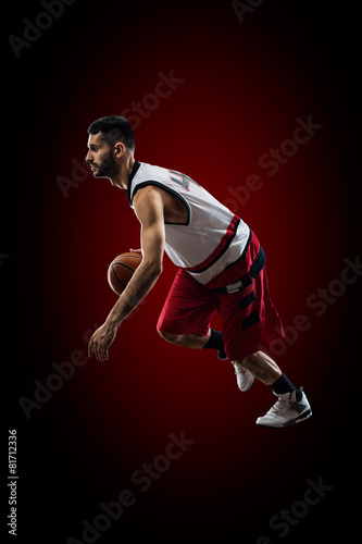 Basketball player in action is flying high