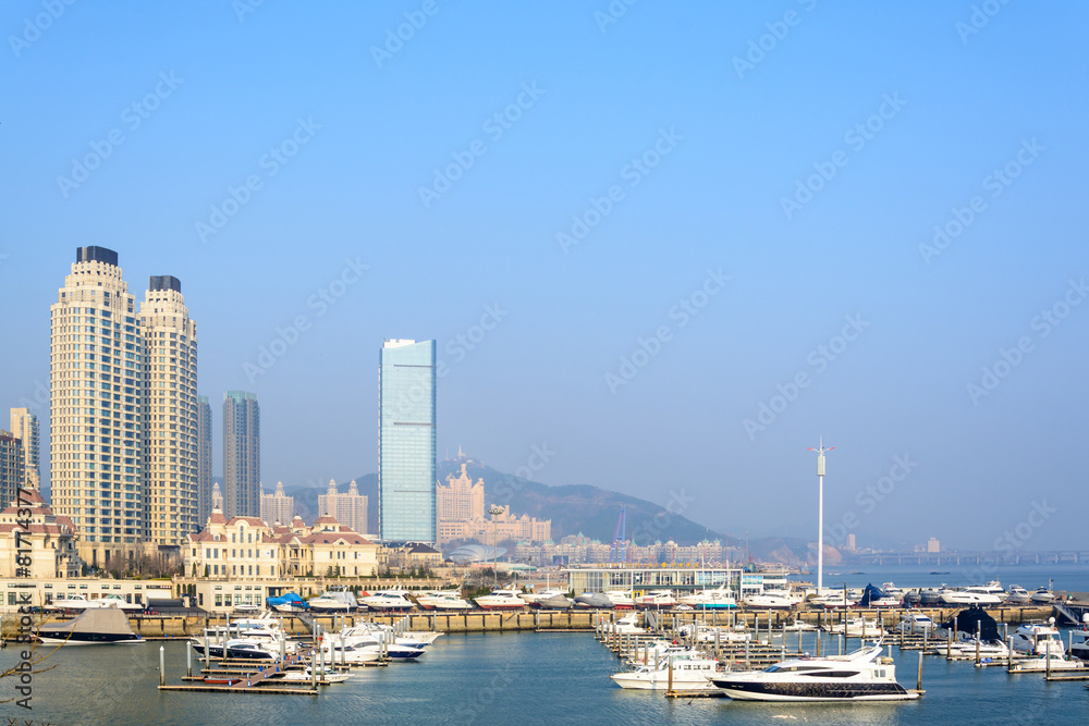 Building and boat at seashore in Dalian