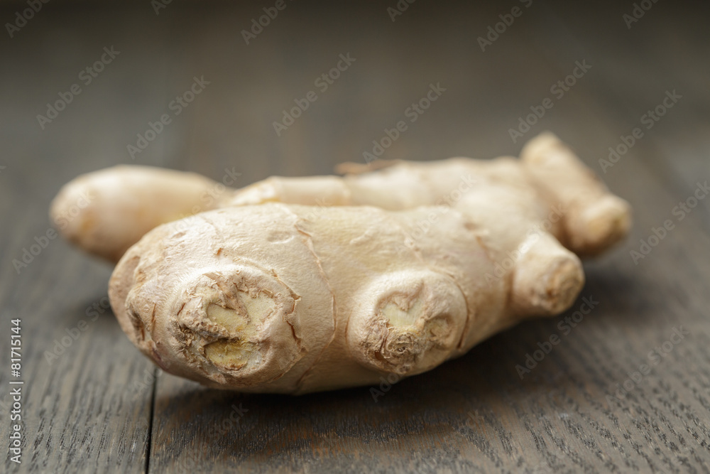 big piece of ginger root on wooden table