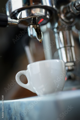 preparing espresso on professional coffee machine