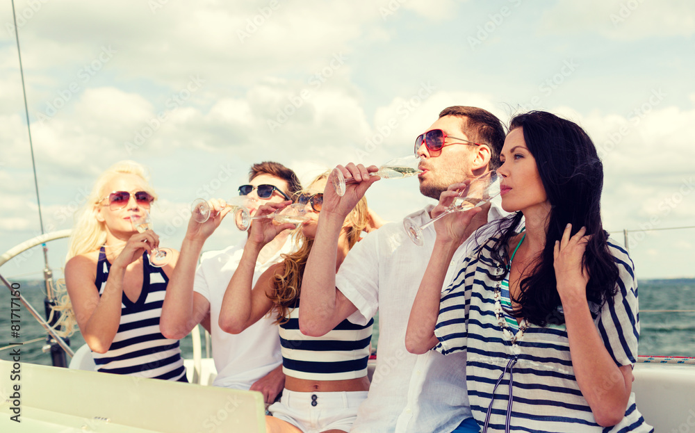 smiling friends with glasses of champagne on yacht smiling friends with glasses of champagne on yacht