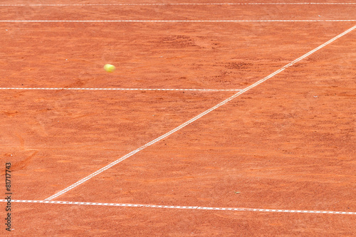 Tennis ball on a clay court © nikolay100
