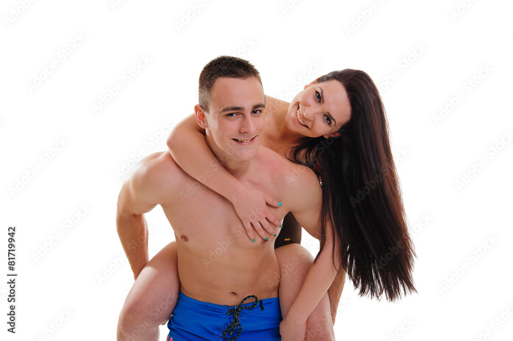 Loving couple in swimwear isolated on white background Loving couple in swimwear isolated on white background