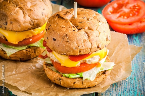 homemade burgers with fresh vegetables and chicken cutlet photo