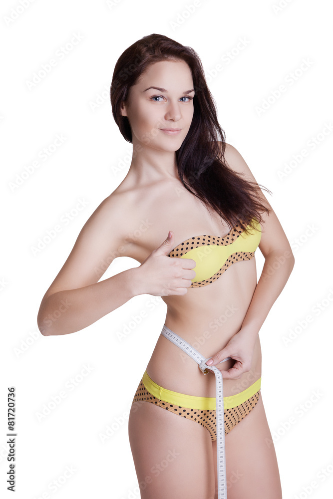 Smiling woman with measuring tape giving thumbs up success hand Smiling woman with measuring tape giving thumbs up success hand