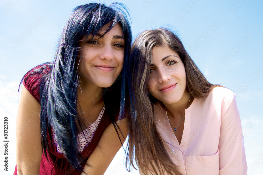 Fototapeta premium Smiling beautiful girls looking camera