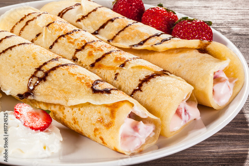 Crepes with strawberries and cream