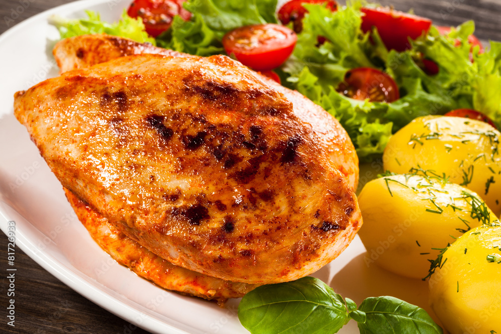Fried chicken fillet, boiled potatoes and vegetable salad Fried chicken fillet, boiled potatoes and vegetable salad