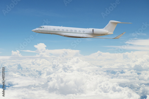 Private jet flying on the sky