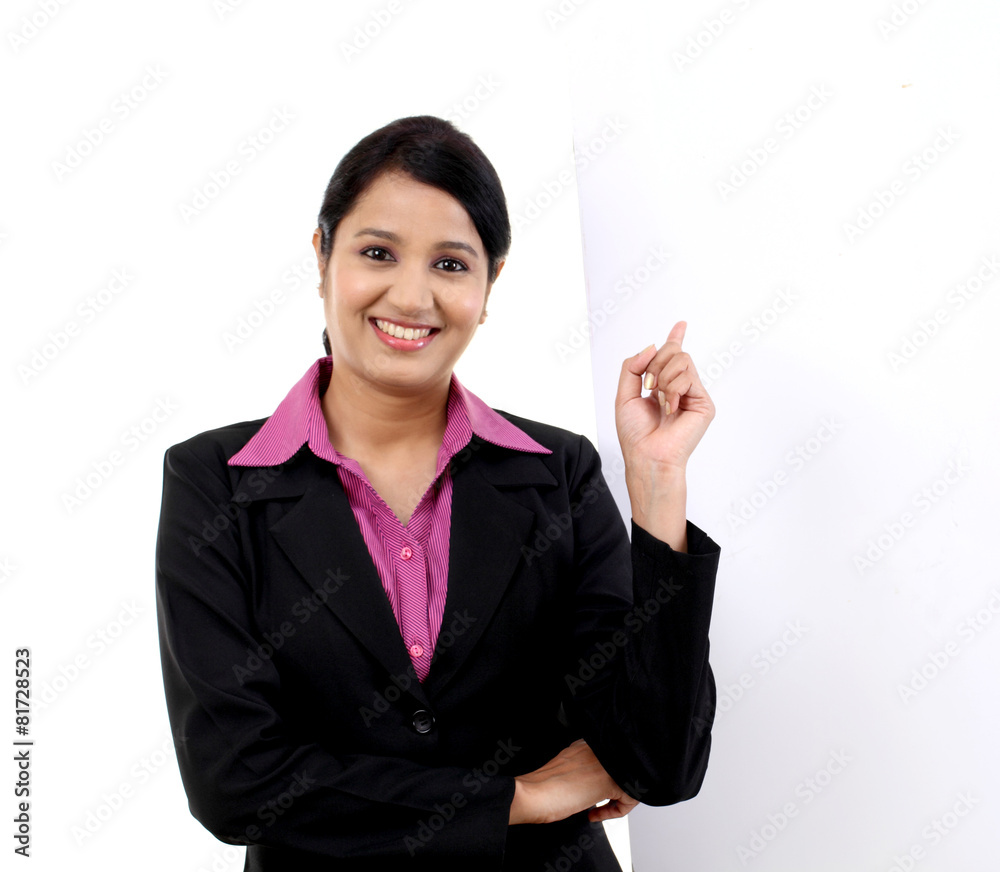 Young happy business woman showing blank signboard, isolated on Young happy business woman showing blank signboard, isolated on
