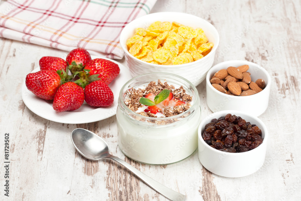 yogurt with berries and breakfast foods, closeup yogurt with berries and breakfast foods, closeup