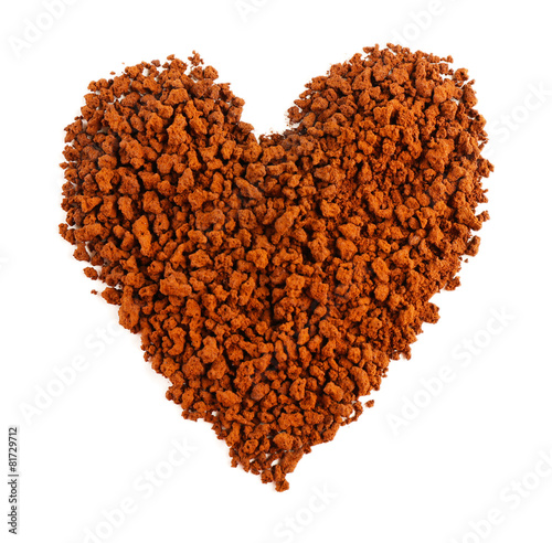 Ground coffee in shape of heart isolated on white