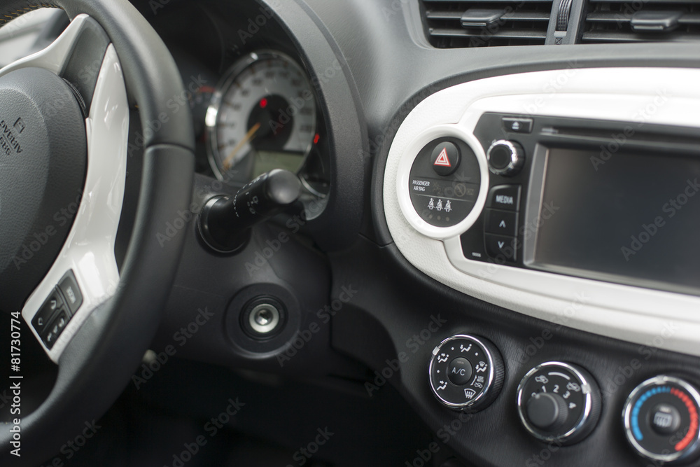 Car dashboard with instruments and steering wheel