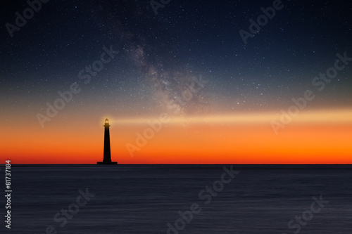 Lighthouse against night sky photo