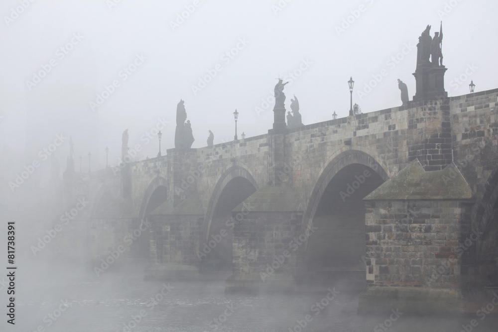 Fototapeta premium Morning fog over the Charles Bridge in Prague.