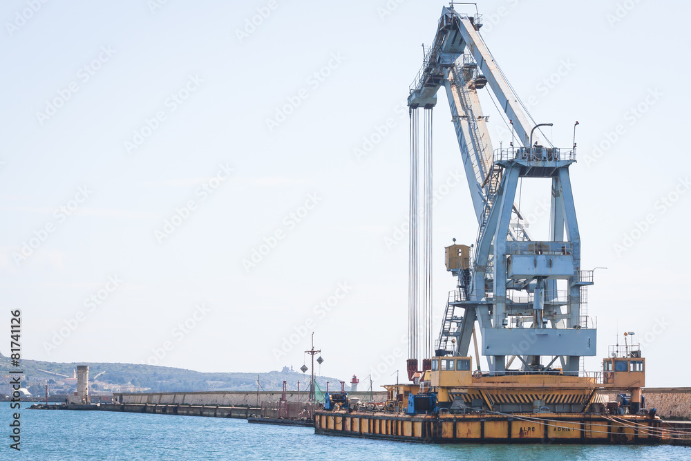 Old crane at the dock of the port