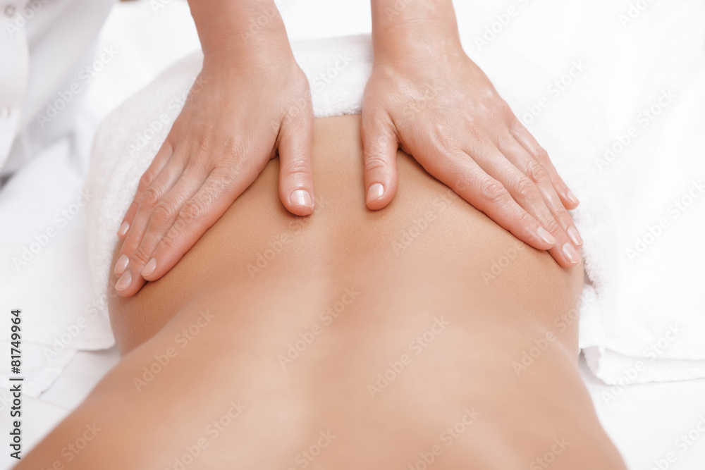 Fototapeta premium Woman gets back massage