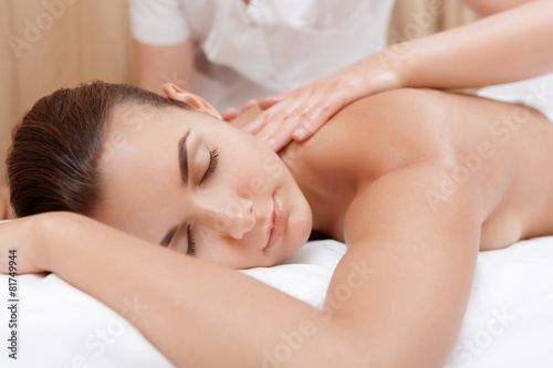 Woman enjoys back massage