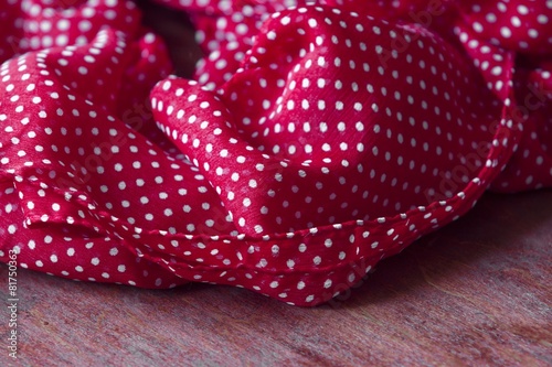 red fabric with white polka dots