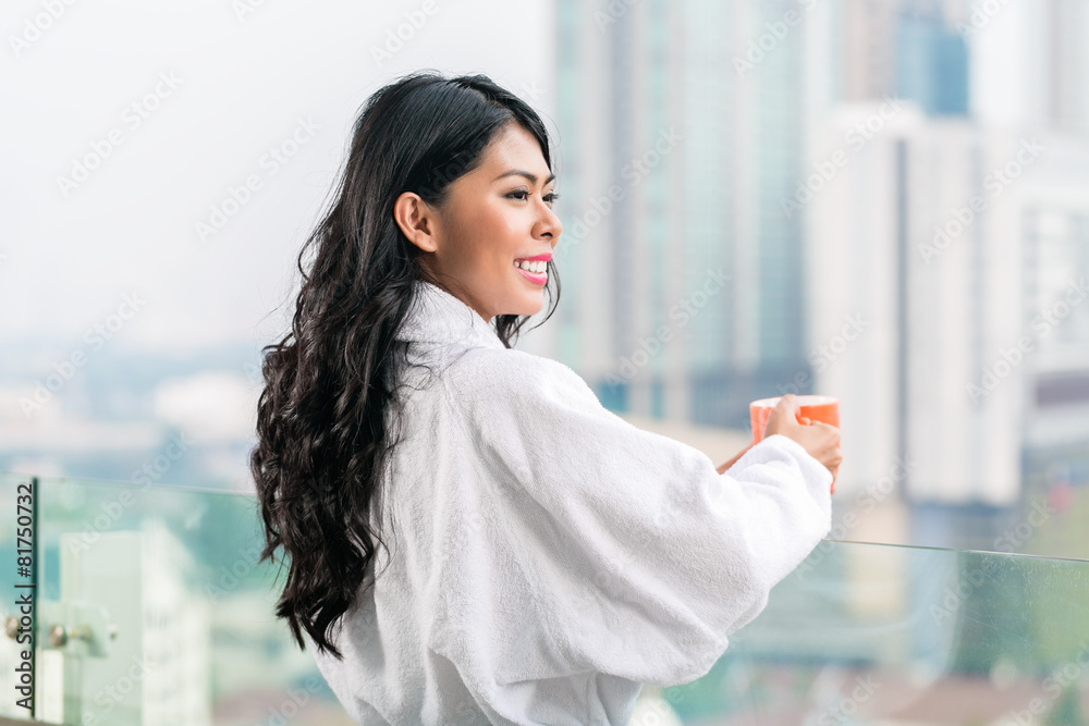 Asian woman in morning front of city skyline Asian woman in morning front of city skyline