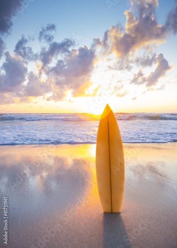 Sticker Surfboard on the beach at sunset