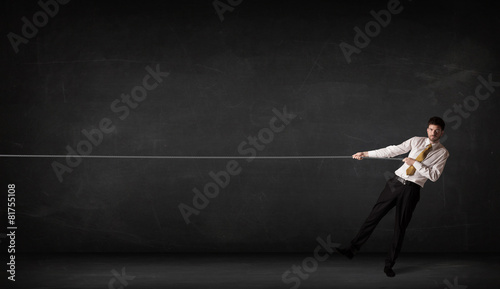 Wallpaper Mural Businessman pulling rope on grey background Torontodigital.ca