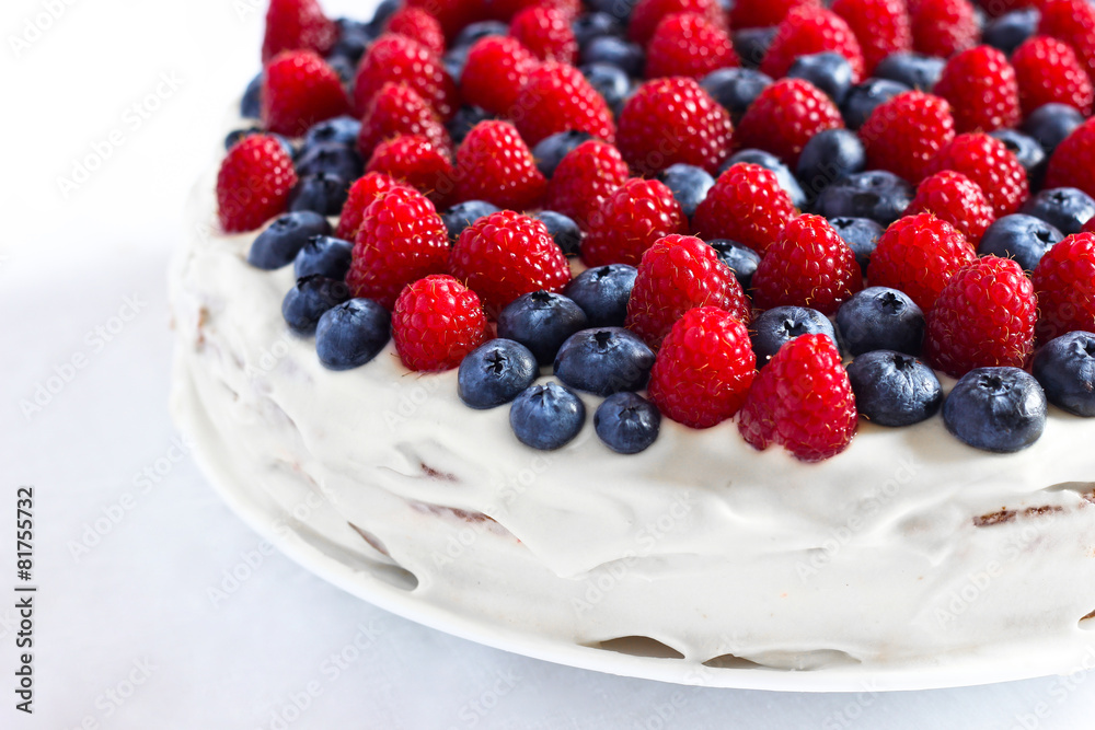 Creamy sweet cake with blueberries and raspberries Creamy sweet cake with blueberries and raspberries
