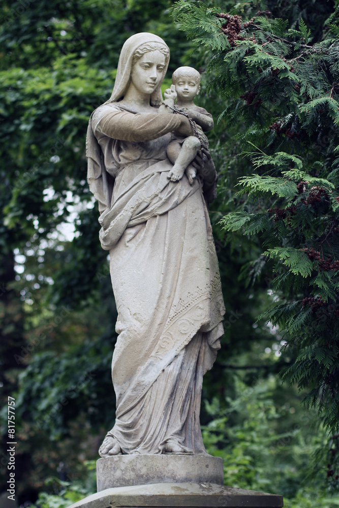 Old statue on grave in the Lychakivskyj cemetery of Lviv, Ukrain Old statue on grave in the Lychakivskyj cemetery of Lviv, Ukrain