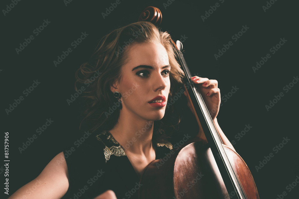 Young aspiring musician playing a cello StockFoto Adobe Stock