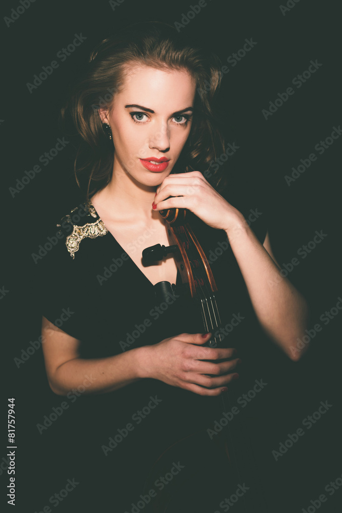 Alluring Female Cellist Holding a Cello Instrument Alluring Female Cellist Holding a Cello Instrument