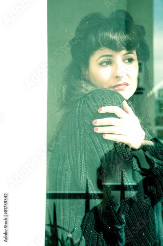 Melancholic Girl at the Window. photo