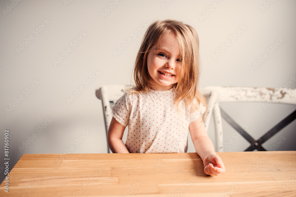 cute happy toddler girl having fun at home in kitchen cute happy toddler girl having fun at home in kitchen