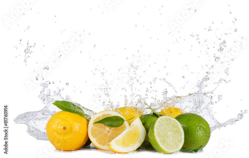 Lemons and limes with water splashes on white