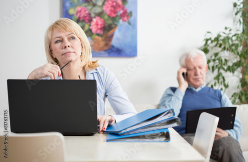 Elderly businesspeople working at home