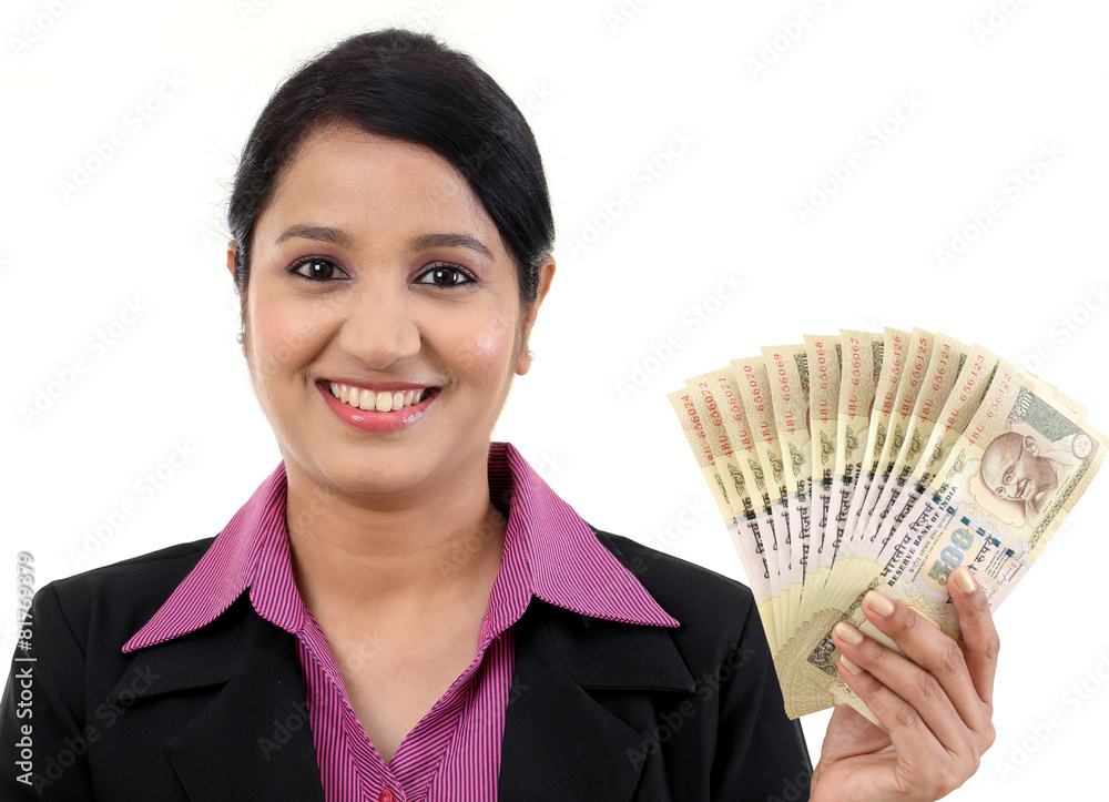 Young business woman holding Indian currency notes Young business woman holding Indian currency notes