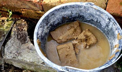 clay brick in bucket