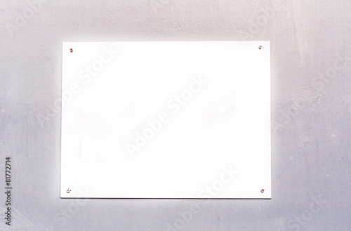 Blank white sign board on wooden background