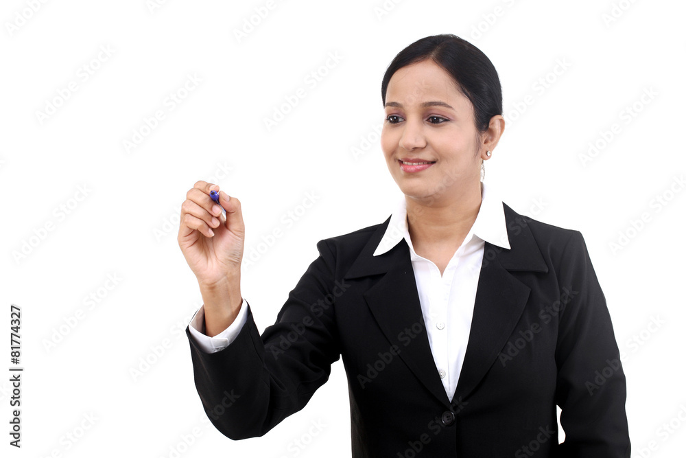 Business woman writing with pen on virtual screen Business woman writing with pen on virtual screen