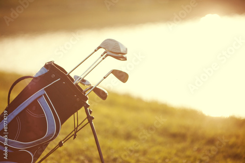 Professional golf gear on the golf course at sunset near lake