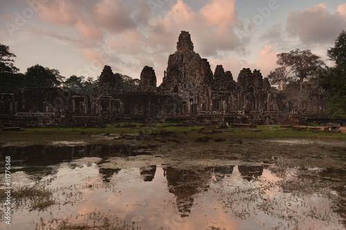 Bayon temple temple at  dusk with reflection
