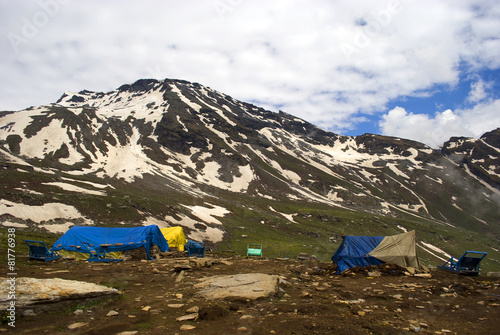 Tents in front of the snowy mountain picks at Rothang pass is the highest point, 4,112m, on the Manali-Keylong road of Himachal Pradesh in India.
