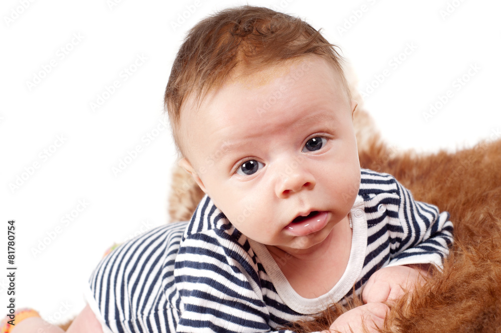 Portrait of adorable baby boy lying on fur Portrait of adorable baby boy lying on fur