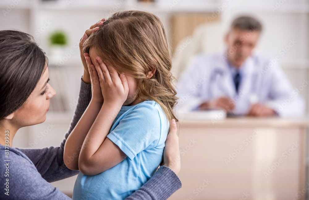 Mom with kid at the doctor. Mom with kid at the doctor.
