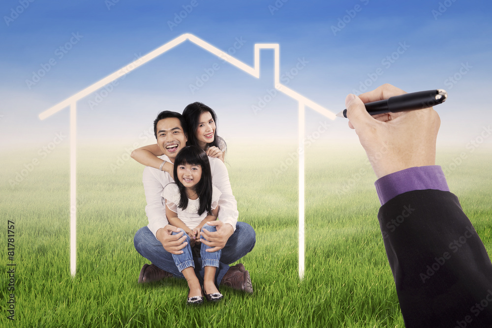 Obraz premium Little happy family with a dream home