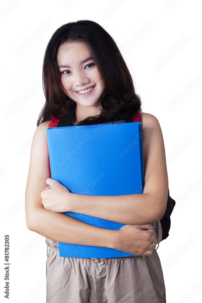 Modern college student smiling in studio Modern college student smiling in studio